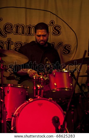 NEW YORK - JANUARY 08: Damion Reid drums performs at Kenny\'s Castaways as part of Winter Jazz Festival on January 08, 2011 in New York