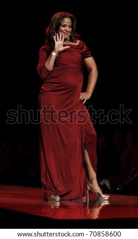 NEW YORK - FEBRUARY 09: Leila Ali in a Pea in the Pod dress walks runway for The Heart Truth\'s Red Dress Collection at Mercedez-Benz Fall/Winter 2011 Fashion Week on February 09, 2011 in New York City.
