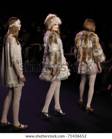 NEW YORK - FEBRUARY 16: Models walk runway for dress presentation by Anna Sui at Mercedes-Benz Fall/Winter 2011 Fashion Week on February 16, 2011 in New York City.