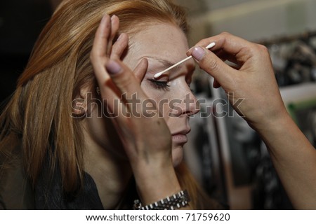 NEW YORK - FEBRUARY 15: Model prepares backstage for presentation at the Concept Korea Fall 2011 at Mercedes-Benz Fashion Week in David Rubenstein Atrium on February 15, 2011 in New York City