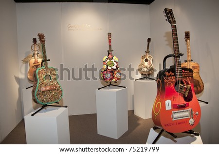 NEW YORK - APRIL 13: Guitars of Art at Sculpture Objects & Functional Art Fair SOFA on Park Avenue Armory on April 13, 2011 in New York City.