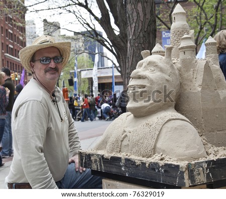 NEW YORK - APRIL 30: John Grubner presents a sand sculpture at Family Festival on Greenwich street as part of 2011 Tribeca Film Festival on April 30, 2011 in New York City.