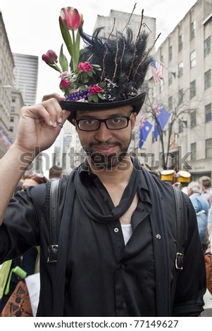 NEW YORK - APRIL 24: An unidentified young man partakes and shows off his hat and costume at the Easter Bonnet Parade on 5th Avenue on April 24, 2011 in New York City.