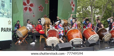 NEW YORK - MAY 22: Members of Japanese drum music groups NY Suwa Taiko Association & Soh Daiko perform as part of 5th annual Japan Day in Central Park on May 22, 2011 in New York City