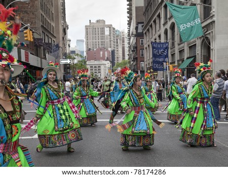 NEW YORK - MAY 21: Members of Tinkus Jacha dances on Broadway as part of New York Dance Parade on May 21, 2011 in New York City