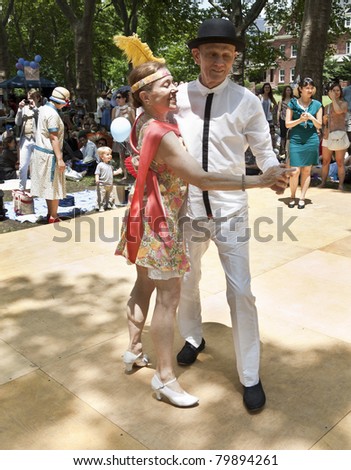 NEW YORK - JUNE 25: James Lake and Renee dance at Michael Arenella and the Dreamland Orchestra the Jazz Age Dance Party on Governors Island on June 25, 2011 in New York City.