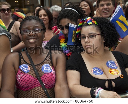 NEW YORK - JUNE 26: Unidentified revelers lined up along the parade route during Pride march along Fifth Avenue on June 26, 2011 in New York City, NY.