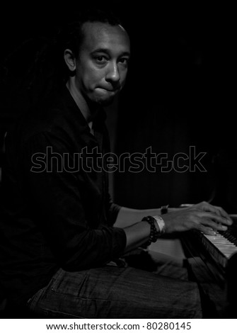 NEW YORK - JUNE 23: Gerald Clayton piano performs at Sullivan Hall bar as part of annual Undead Jazz Festival on June 23, 2011 in New York City.