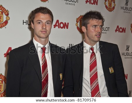 NEW YORK - JULY 25: Footballers Jonny Evans and Michael Carrick attend Hublot \'Art of Fusion\' fashion show with Sir Alex Ferguson & Manchester United at Cipriani, Wall Street on July 25, 2011 in NYC