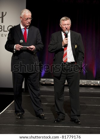 NEW YORK CITY- JULY 25: Hugh Hildesley (L)  & Sir Alex Ferguson conduct auction at Hublot \'Art of Fusion\' fashion show with Sir Alex Ferguson & Manchester United at Cipriani Wall Street on July 25, 2011 in New York City, NY