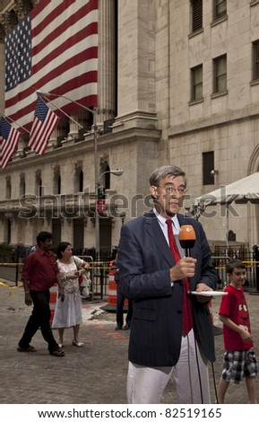 NEW YORK - AUGUST 08: German journalist Klaus Proempers of ZDF TV network reports live from Wall street in front of NYSE about market crash on August 08, 2011 in New York, NY
