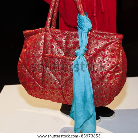 NEW YORK - SEPTEMBER 09: Model shows off handbag at presentation for Electric Feathers collection by Leana Zuniga at Mercedes-Benz Spring/Summer 2012 Fashion Week on September 09, 2011 in New York City