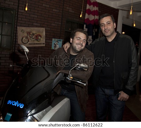 NEW YORK - OCTOBER 06: Founder Mazdack Rassi (R) at Evolve launch 100%-electric motorcycle made in USA at the party in Milk Studio in Manhattan on October 06, 2011 in New York.