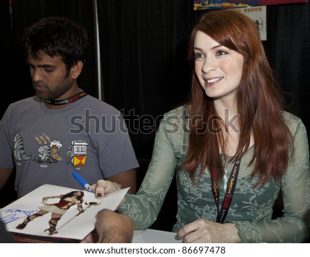 NEW YORK - OCTOBER 15: Author Felicia Day signs autograph during New York Comic Con 2011 in Javits Center on October 15, 2011 in New York.