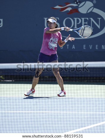 NEW YORK - AUGUST 29: Na Li of China practices at USTA Billie Jean King National Tennis Center during US Open on August 29, 2011 in New York City.