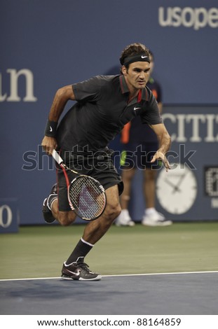 NEW YORK - AUGUST 29: Roger Federer of Switzerland returns ball during 1st round match against Santiago Giraldo of Columbia at USTA Billie Jean King National Tennis Center on August 29, 2011 in NYC