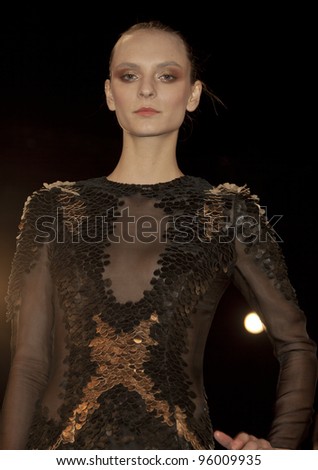 NEW YORK - FEBRUARY 12: Model shows off dress by Mathieu Mirano collection during Fashion week at Lincoln Center in Manhattan on February 12, 2012 in New York City