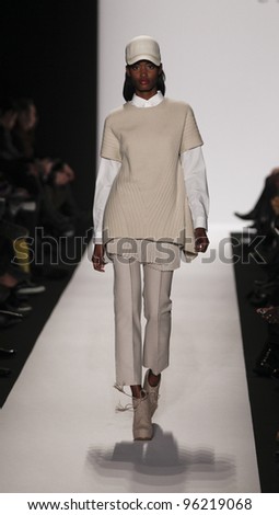 NEW YORK - FEBRUARY 10: Model walks runway for Academy of Art University collection by Xiang Zhang during Fashion week at Lincoln Center in Manhattan on February 10, 2012 in New York City