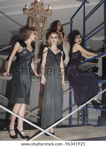 NEW YORK - FEBRUARY 09: Models show off dresses for Deca-Dance collection by Erickson Beamon during Fashion week at Milk Studio in Manhattan on February 09, 2012 in New York City
