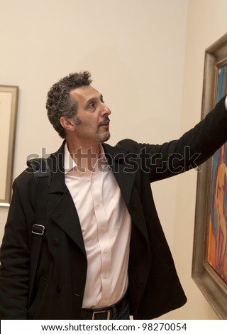 NEW YORK - MARCH 22: Actor John Turturro attends opening of exhibition of paintings by Robert De Niro at DC Moore gallery in Manhattan on March 22, 2012 in New York City