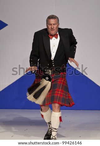 NEW YORK - APRIL 02: CEO of Pitcairn Investments Dirk Junge in kilt by Glenisla walks runway at fashion show From Scotland With Love at The Liberty Theatre on April 2, 2012 in New York City