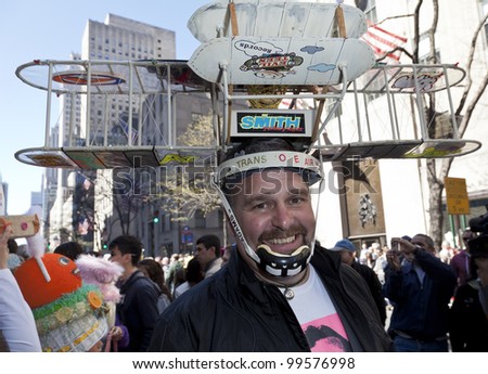 NEW YORK - APRIL 08: Unidentified man partakes and shows off his hat and costume at the Easter Bonnet Parade on 5th Avenue on April 8, 2012 in New York City.