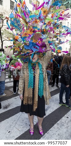 NEW YORK - APRIL 08: Unidentified woman partakes and shows off her hat at the Easter Bonnet Parade on 5th Avenue on April 8, 2012 in New York City.