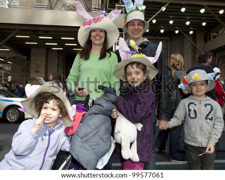 NEW YORK - APRIL 08: Unidentified family partake and show off their hats at the Easter Bonnet Parade on 5th Avenue on April 8, 2012 in New York City.