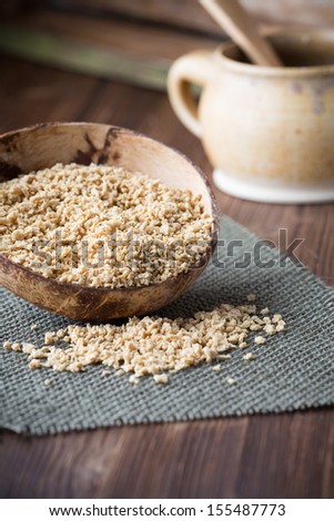 Soy wooden bowl on a wooden surface, eco product.