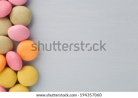 Small round candy-colored pastels on pastel background.