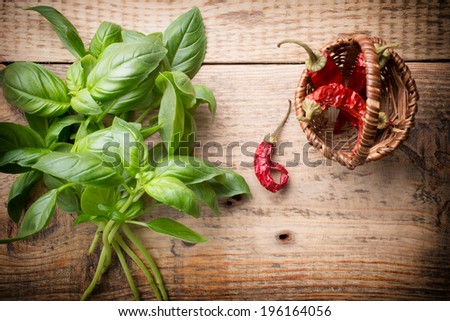 Bunch fresh basil on a wooden background. Aromatic spice.