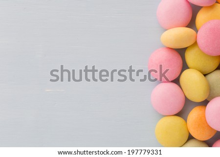 Small round candy-colored pastels on pastel background.