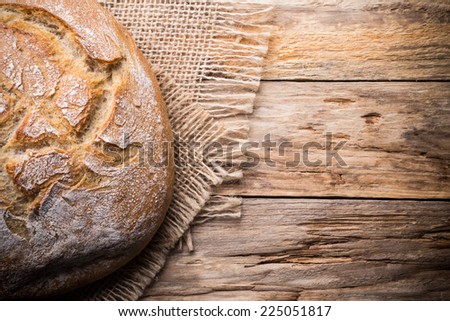 Fresh  bread on a wooden background. Studio photography.