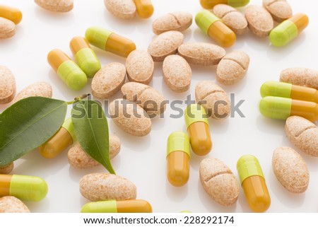 Natural vitamin supplements on the white  background.