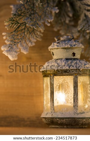Lantern on a snowy background. Christmas decor. Christmas scene.