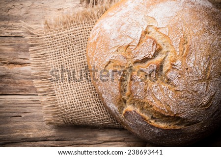 Fresh  bread on a wooden background. Studio photography.