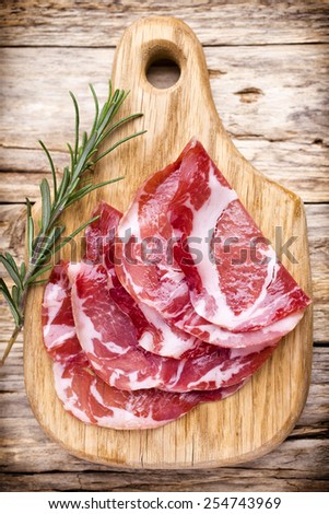 Dried pig meat slices. Delicatess.