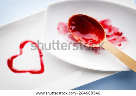 Raspberry jam spoon. Studio photography.