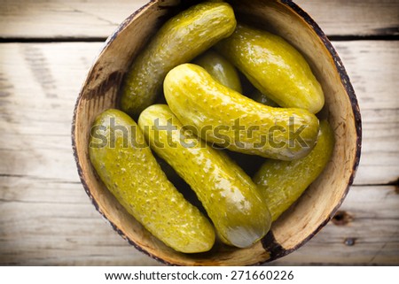 Pickles wooden bowl on the table. Vegetable.
