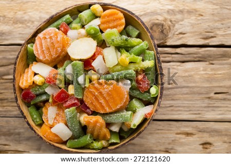 Frozen vegetables  in a wooden table.