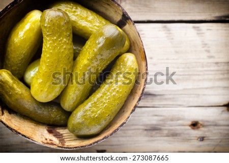 Pickles wooden bowl on the table. Vegetable.