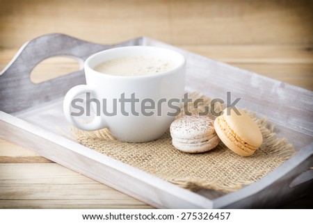 Macaroons and coffee on the table. Studio shoot.