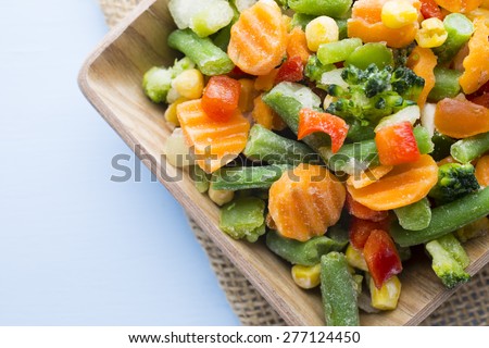 Frozen vegetables  in a wooden table.
