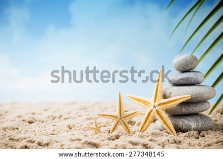 Stones spa treatment scene on the sea beach, zen like concepts.