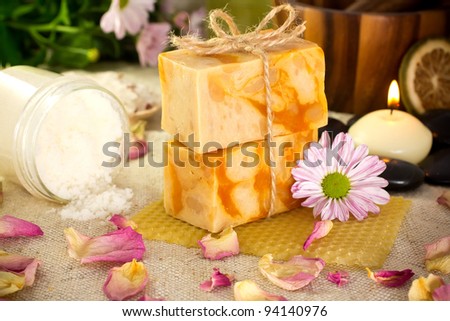 Natural soap from honey. Olive oil, massage stones with a candle, mortar with a pestle. Health spa for spa treatment.
