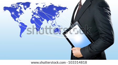 Business man holding digital tablet PC to connect with the world