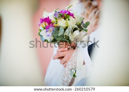 Wedding bouquet in bride\'s hand