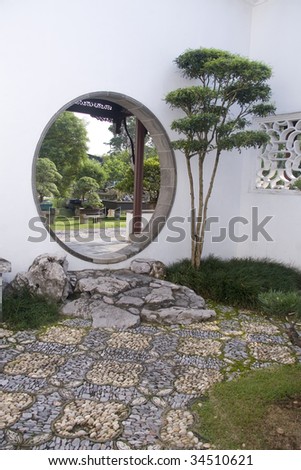 A wide chinese style garden with trees and plants