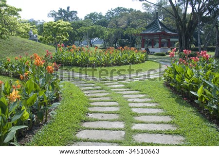 Chinese style garden with flowers and pavilion.