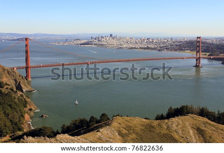GOLDEN GATE NATIONAL RECREATION AREA, CALIFORNIA: Golden Gate Bridge taken from Hawk Hill overlook in Marin County near Sausalito with sailboat in foreground.
